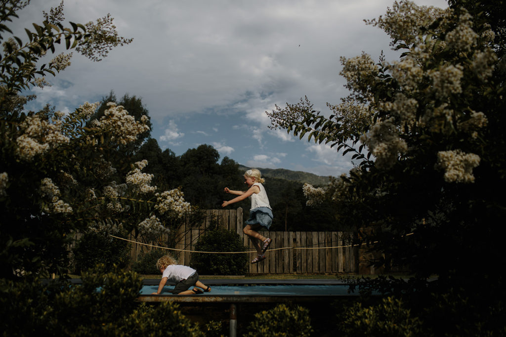Wes anderson style wedding photography - kids on trampoline