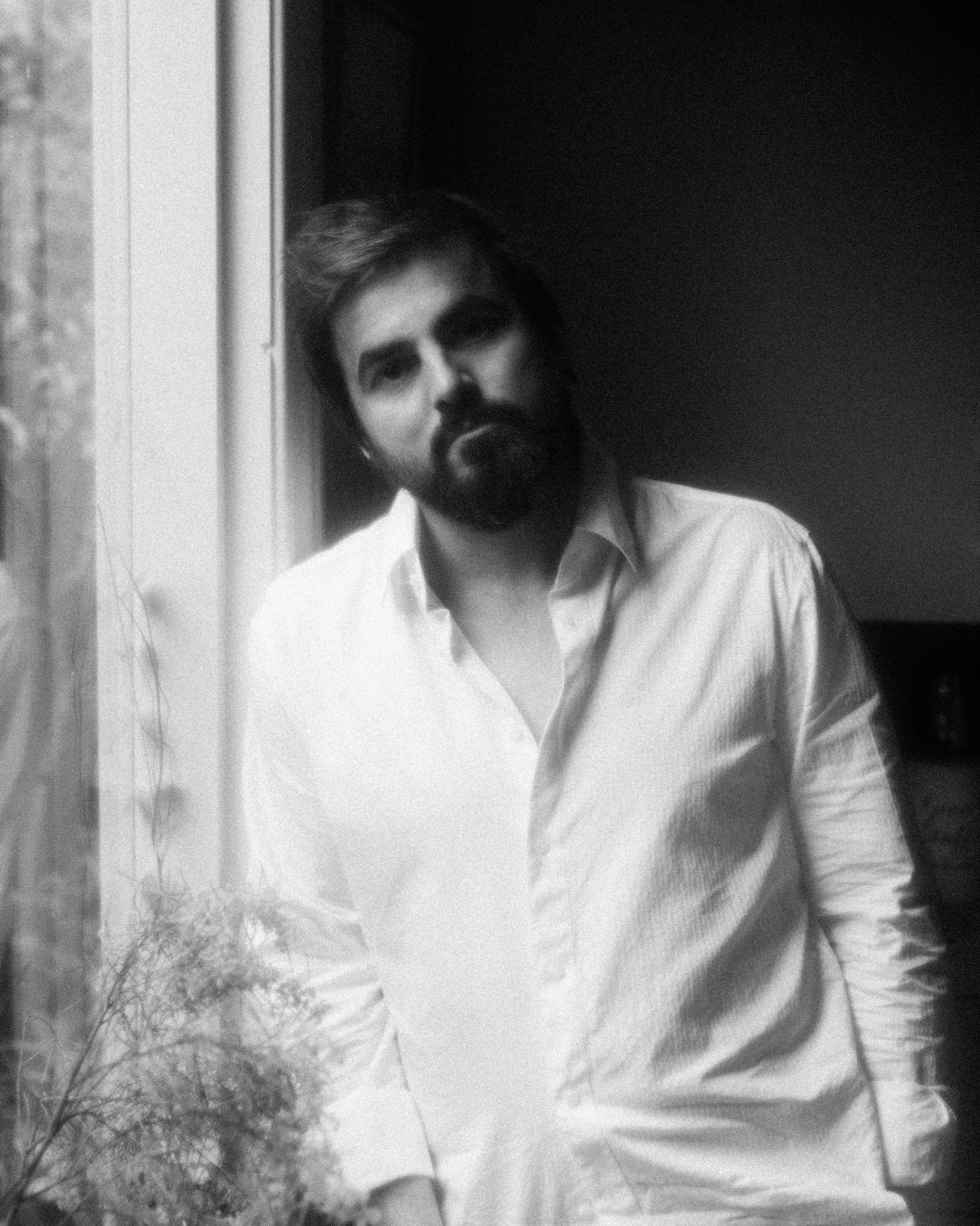 A black and white soft photograph of Melbourne musician Shayne